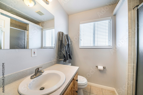 Bathroom interior with window and vanity sink unit