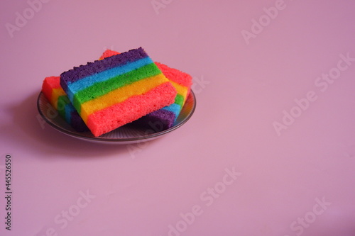 a plate of slices of rainbow cake