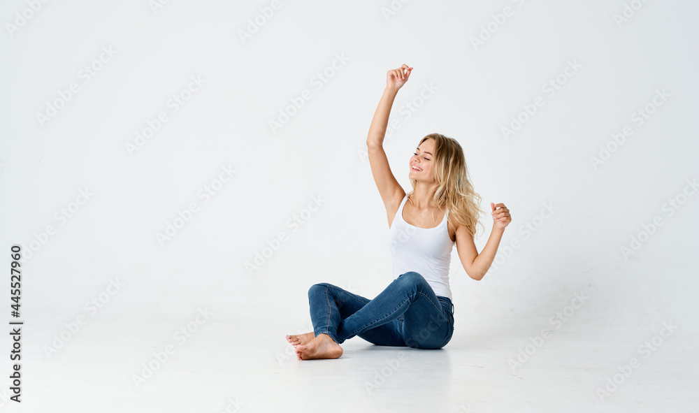 woman sitting on the floor fun emotions fashionable hairstyle studio woman sitting on the floor fun emotions fashionable hairstyle studio