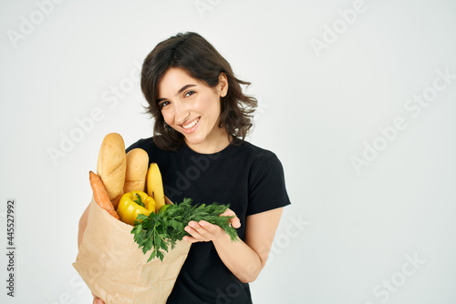 cheerful brunette i package with groceries healthy food delivery k-supermarket