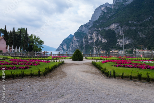 Promenade with colorful flowerbeds in Riva del Garda Italy