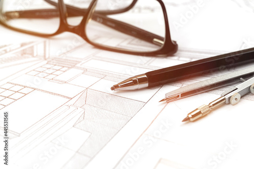 Drawings and plans for house construction background with pencil and glasses on office table