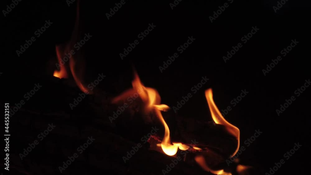 Burning wood in the stove. flame in the fireplace. slow motion Burning wood in the stove. flame in the fireplace. slow motion