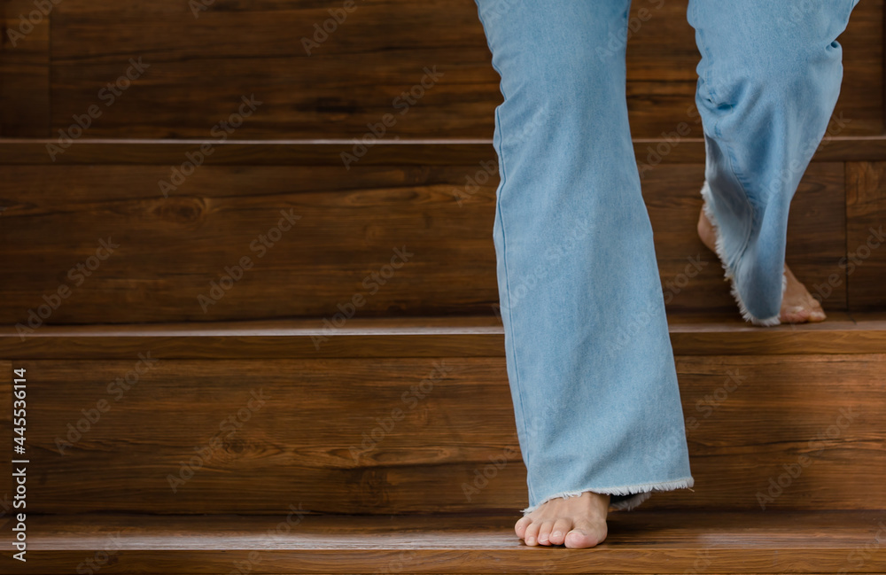 Feet walking on stairs with an unsteady gesture. Concept of Guillain