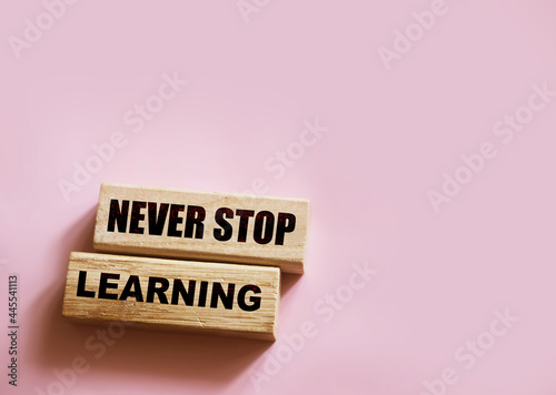 Text Never Stop Learning on a wooden blocks. Education concept