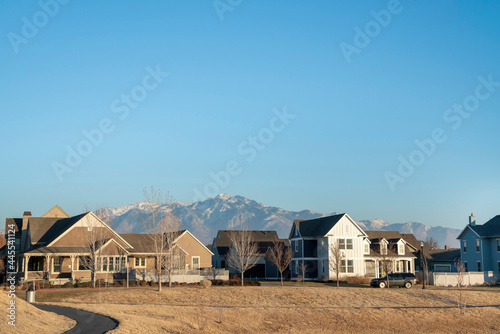 Residential area during golden hour against the view of mountains