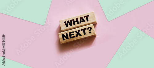 Words What Next on wooden blocks. Next steps concept for business or medicare