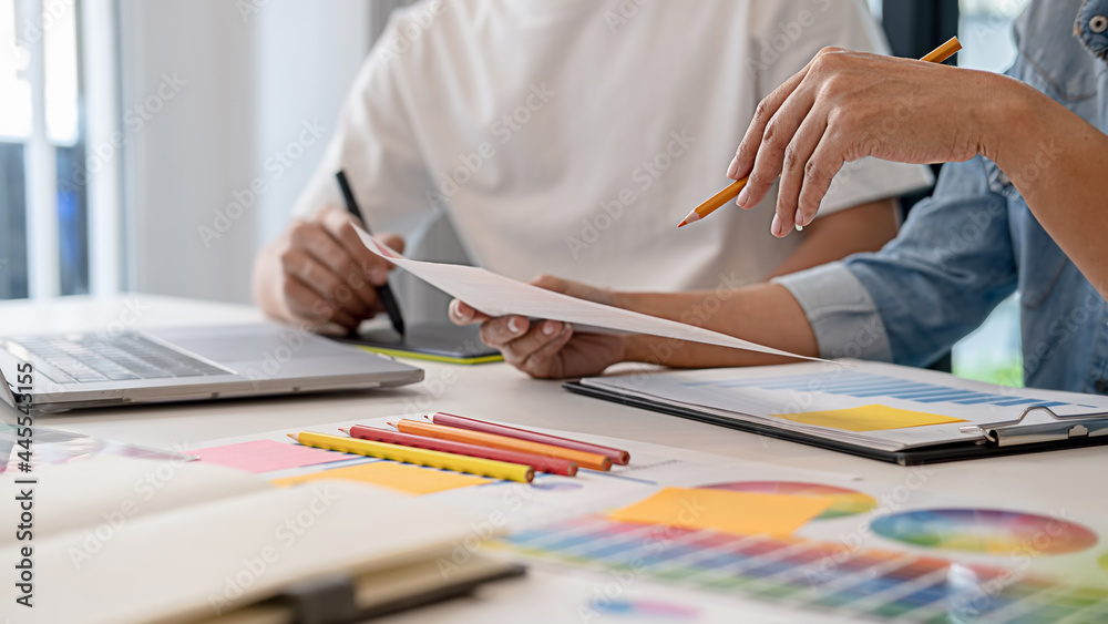 Graphic design and color swatches and pens on a desk. Architectural drawing with work tools and accessories. Graphic design and color swatches and pens on a desk. Architectural drawing with work tools and accessories.