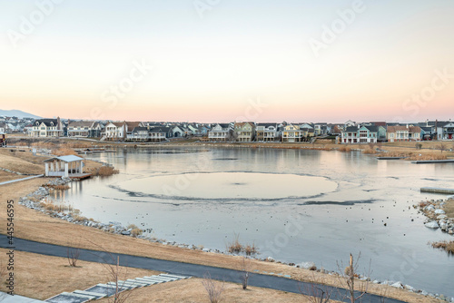 Wallpaper Mural Lake in the middle of a residential community with concrete trails on the side Torontodigital.ca