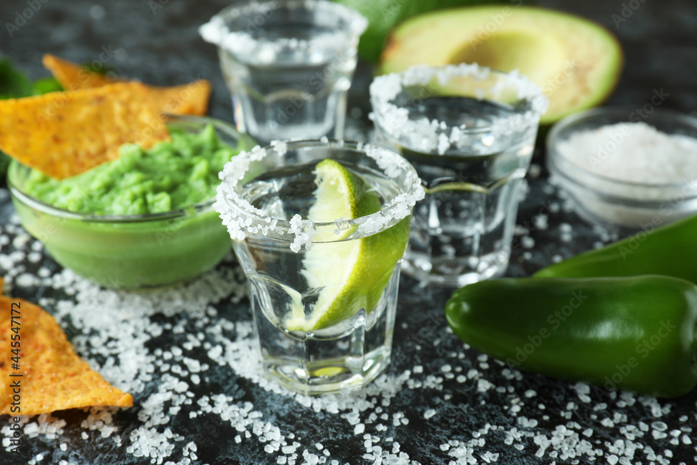 Party concept with tequila, guacamole and chips Party concept with tequila, guacamole and chips