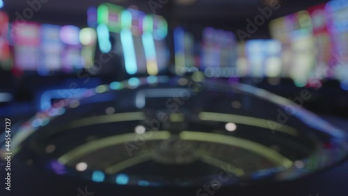 Wallpaper Mural Blurry Shot Of Casino Game With Glowing Lights At The Casino. static Torontodigital.ca