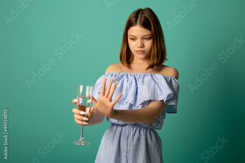 beautiful young woman refusing alcohol 