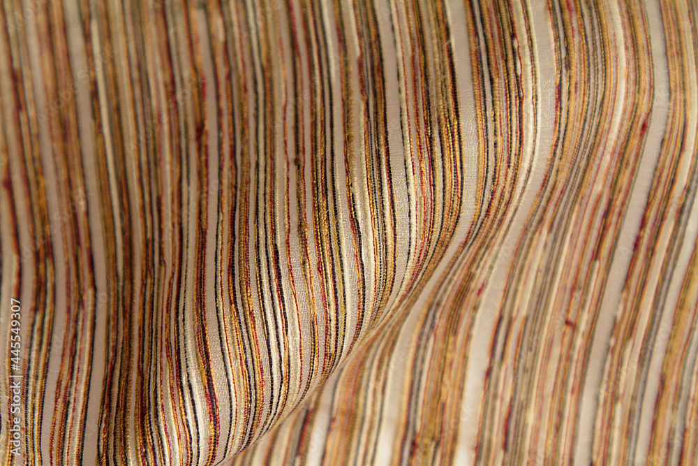 Fabric background with multicolored variegated thin strokes.Abstract fabric style with a wave in the middle of the background Fabric background with multicolored variegated thin strokes.Abstract fabric style with a wave in the middle of the background