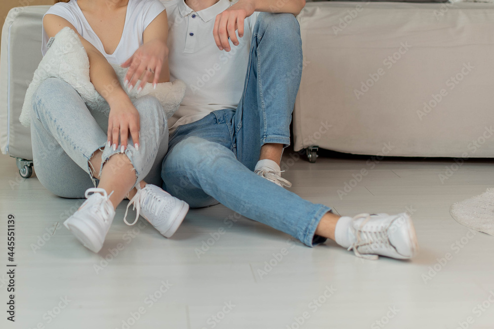 Legs Of Stylish Teen Friends or couple sitting inside. summer, education, campus, people and teenage concept - close up of students. Urban stylish trendy young teenage people with legs Legs Of Stylish Teen Friends or couple sitting inside. summer, education, campus, people and teenage concept - close up of students. Urban stylish trendy young teenage people with legs