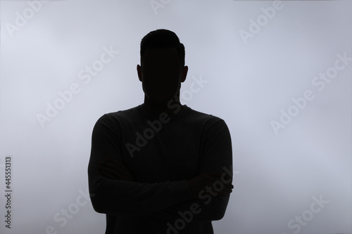 Silhouette of anonymous man on white background photo