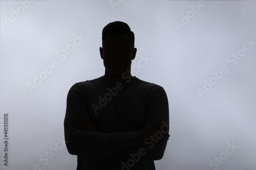 Fotografie Silhouette of anonymous man on white background