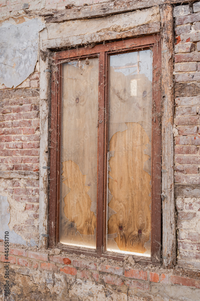 Fragment with a window of an old building before demolition Fragment with a window of an old building before demolition