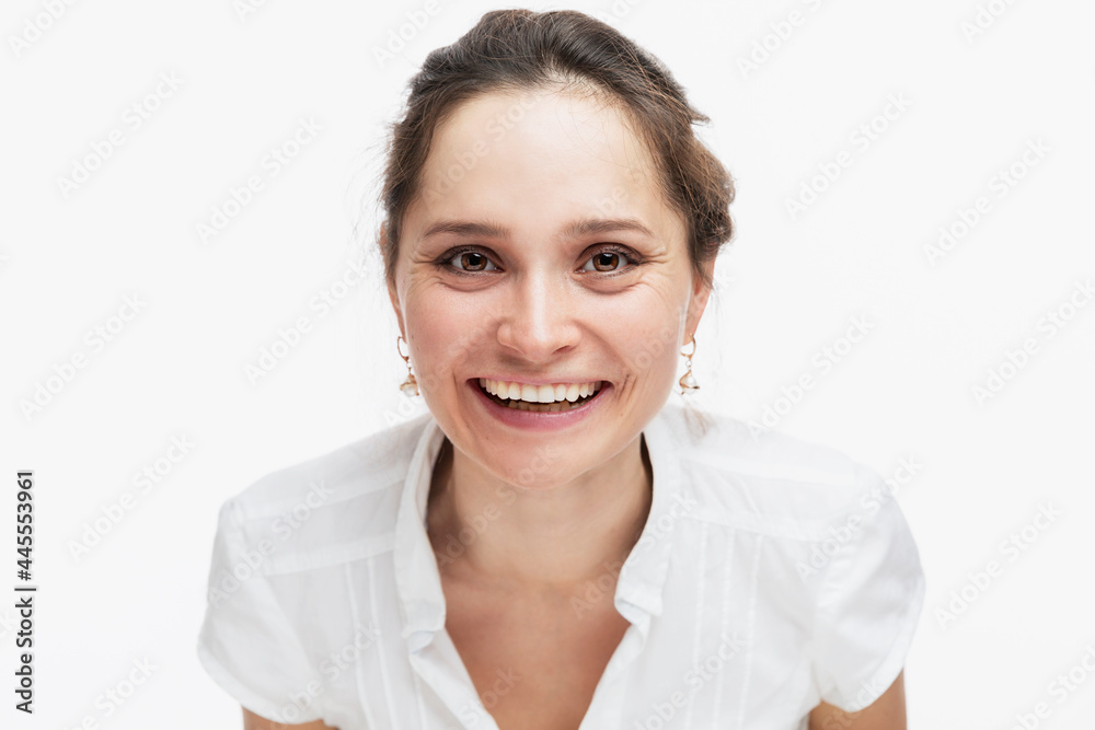 Young woman laughs. Positiveness and joy. Isolated on white background. Young woman laughs. Positiveness and joy. Isolated on white background.