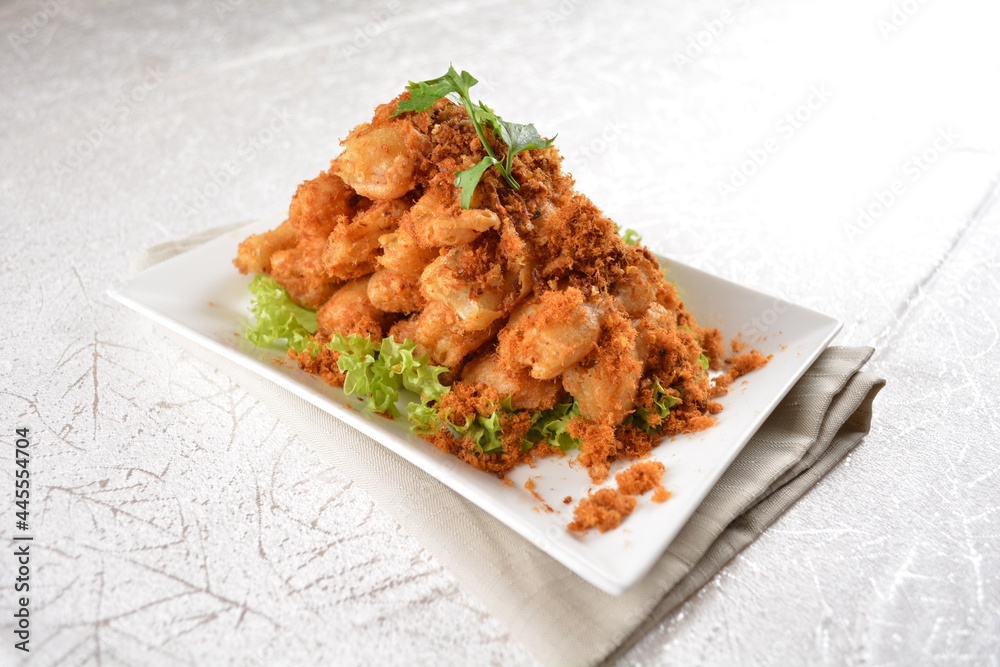 Deep fried crispy golden egg plant with chicken floss appetiser platter in white background appetiser halal menu Deep fried crispy golden egg plant with chicken floss appetiser platter in white background appetiser halal menu