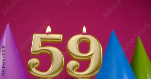 Burning birthday cake candle number 59. Happy Birthday background  photo