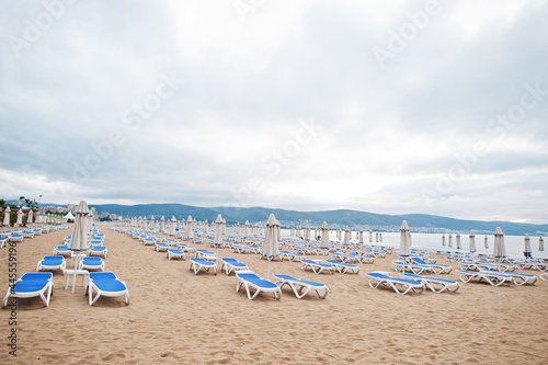 Sunny Beach on Black Sea in Bulgaria. Summer vacation travel holiday. Sunbeds. © AS Photo Family