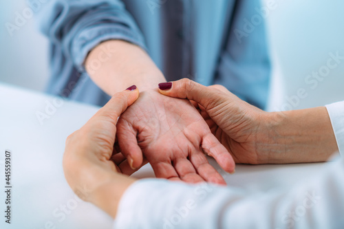 Examining Hand of Senior Patient with Carpal Tunnel Syndrome. Close-up Image of Senior Woman’s Wrist.