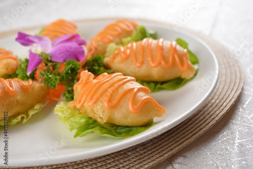 Deep fried bean curd pipa tofu with Chef special salad sauce on white background Asia halal menu