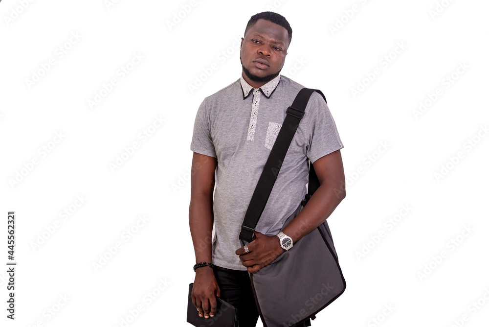 worried young man with bag on shoulder holding digital tablet. worried young man with bag on shoulder holding digital tablet.