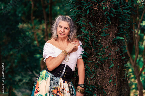 Photography gypsy woman background trees.
