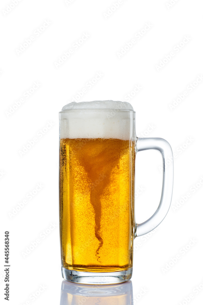 Storm in Mug with fresh beer and cap of foam isolated on white background Storm in Mug with fresh beer and cap of foam isolated on white background