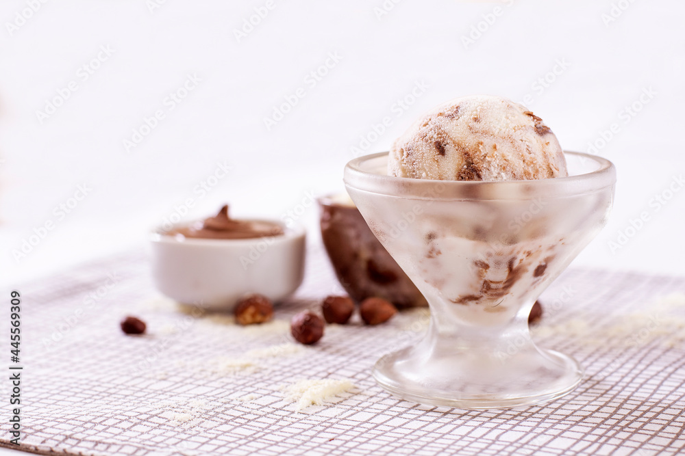 Powdered milk ice cream with chocolate in a glass with ingredients used to decorate the background Powdered milk ice cream with chocolate in a glass with ingredients used to decorate the background