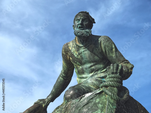 Sculpture of a sailor with a lifebuoy in a public park in Porto in Portugal photo