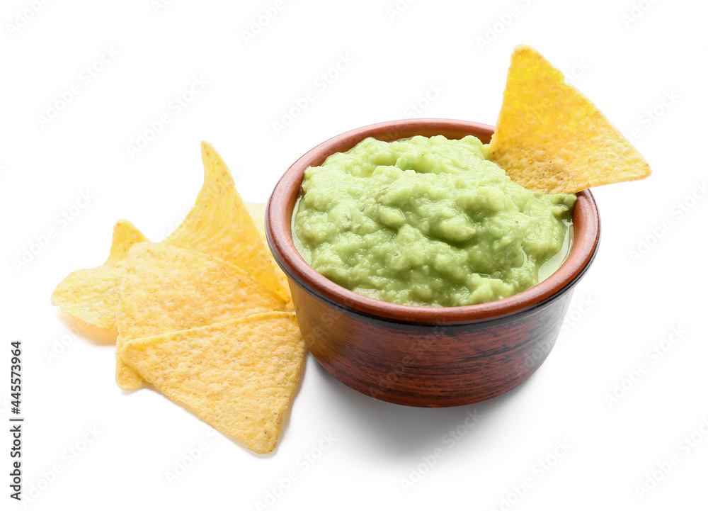 Bowl with tasty guacamole and nachos on white background Bowl with tasty guacamole and nachos on white background
