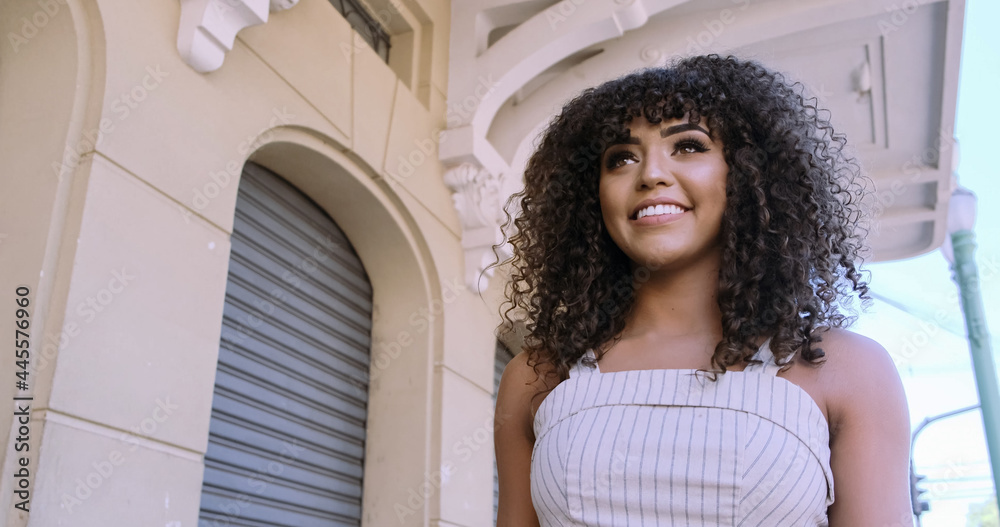 Beautiful Afro American woman walking in the city. Beautiful Afro American woman walking in the city.