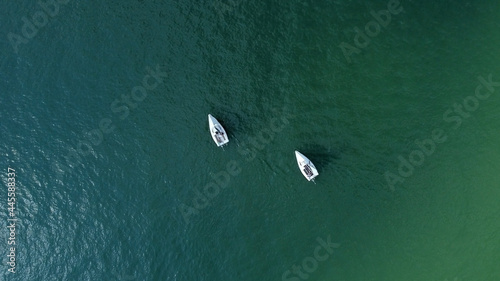 Aerial drone view of sailing boat on a river. photo