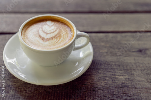 Fototapeta Naklejka Na Ścianę i Meble -  Latte art coffee in a white mug