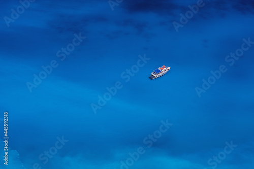 Sailing pleasure boat in calm deep blue water of Mediterranean sea, summer vacation travel activities in Greece