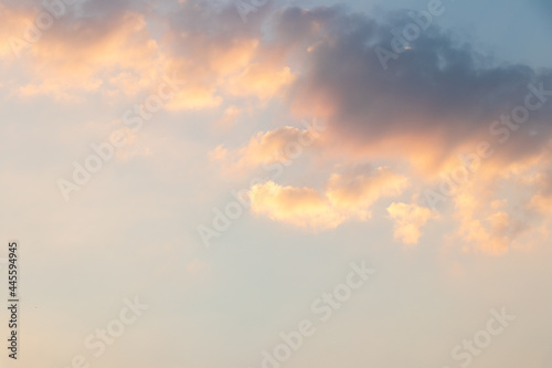 Beautiful orange color light sky with cloud background from sunset