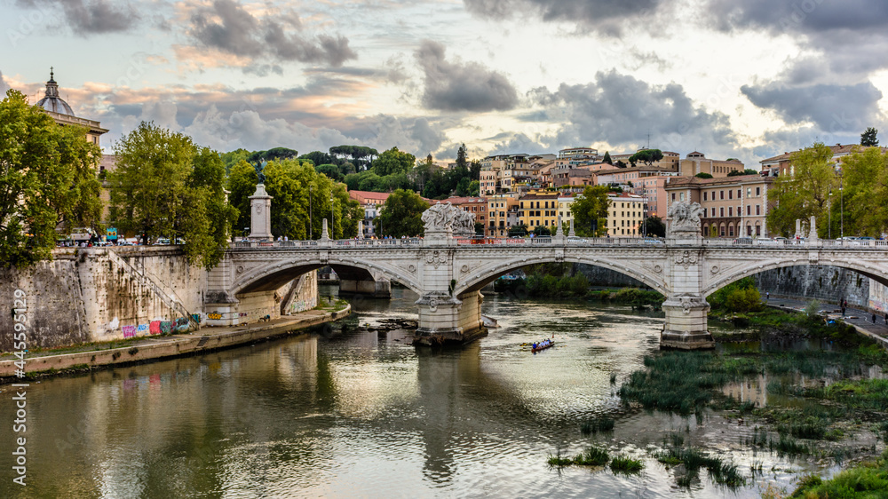 Fototapeta premium A bridge on the river Tiber at sunset in Rome, Italy