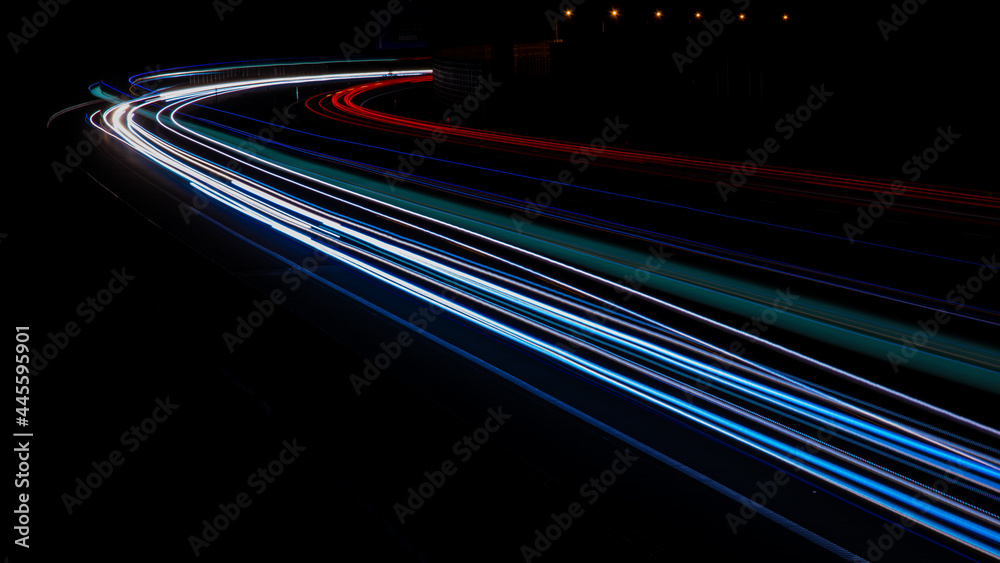 Night road lights. Lights of moving cars at night. long exposure multicolored