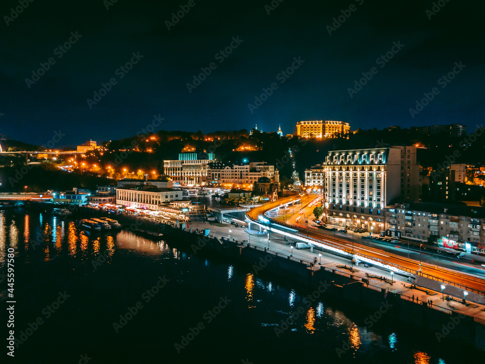 Aerial view from a drone of the embankment and the center of Kiev at night