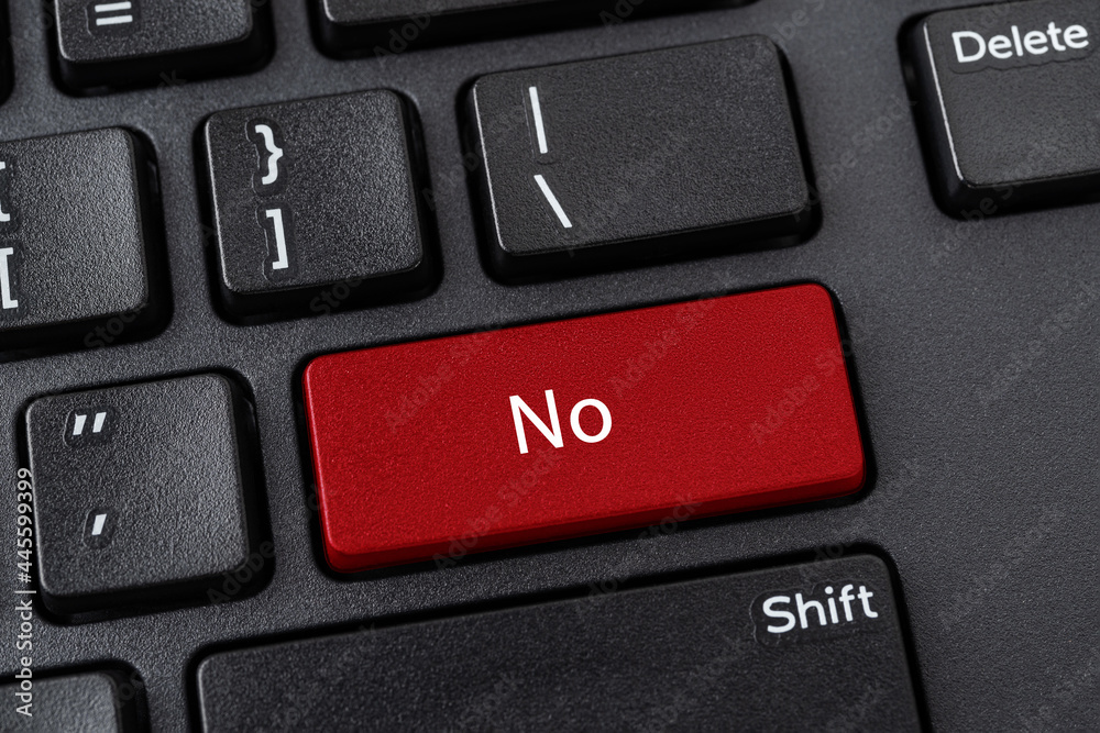 Desktop keyboard with No button. Red key with word No on a black computer keyboard. Keypad enter button with message. Concepts of refusal, disagreement and unacceptability. Desktop keyboard with No button. Red key with word No on a black computer keyboard. Keypad enter button with message. Concepts of refusal, disagreement and unacceptability.