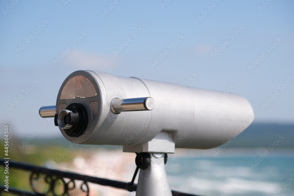 coin operated monocular on the beach