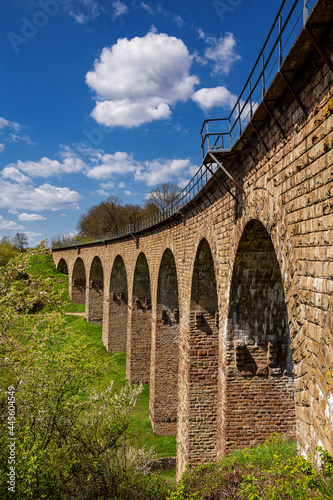 Old railway stone viaduct in the spring in sunny day. photo
