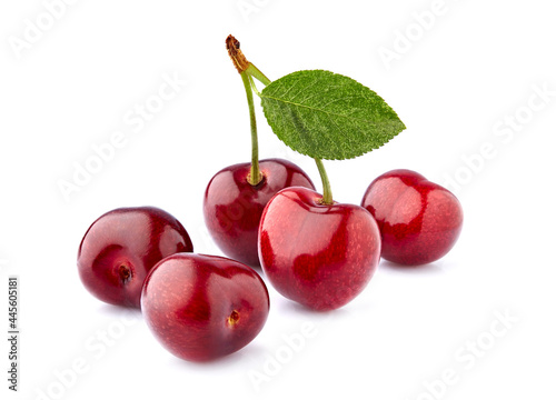 Sweet cherries  isolated on white background cutout. Ripe berries with leaf closeup.