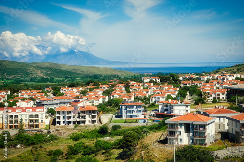 View of the city of G  k  eada  Imbros Island Canakkale Turkey . Opposite is the island of Samothrace  37 km away.