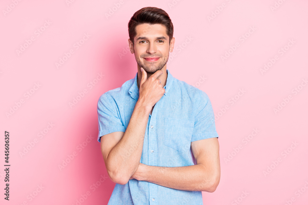 Photo of smart confident guy hand chin think thoughts wear blue shirt isolated on pink color background Photo of smart confident guy hand chin think thoughts wear blue shirt isolated on pink color background