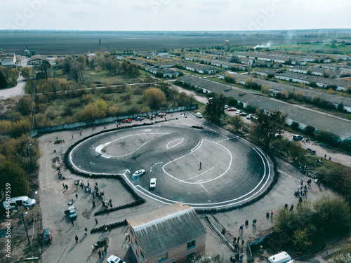 Aerial view from drone on sports track for drifting by cars