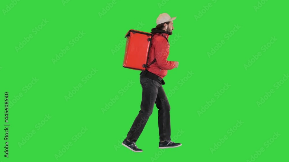 Delivery man running with thermo backpack on a Green Screen, Chroma Key. Delivery man running with thermo backpack on a Green Screen, Chroma Key.