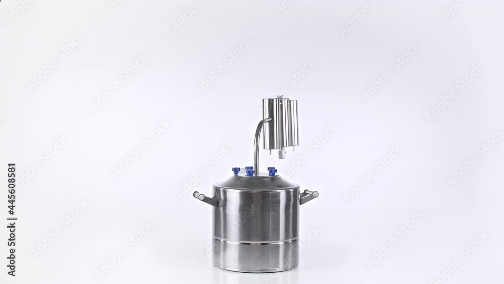 Isolated rotating moonshine distiller on white Isolated rotating moonshine distiller on white